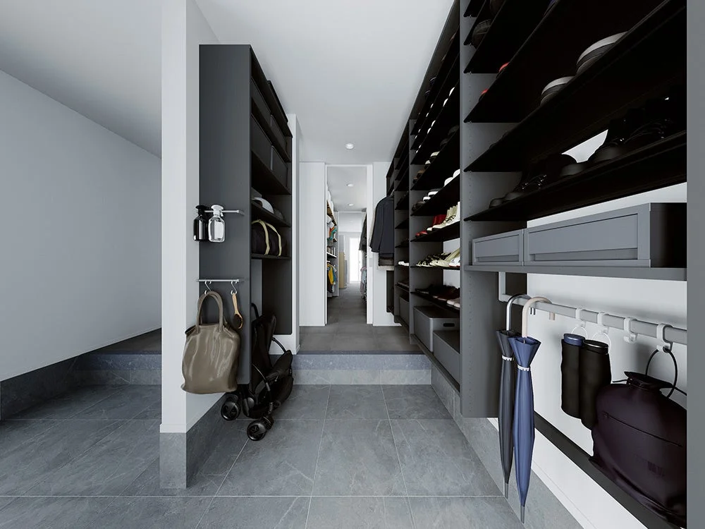 モダンなデザインの玄関にあるダークグレーの収納