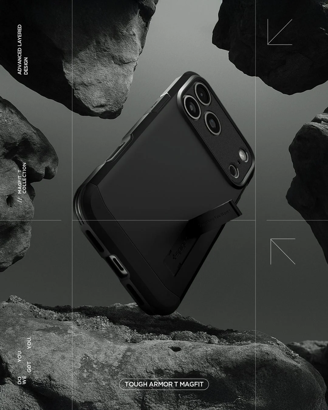 黒い岩のような背景に、Spigenの「TOUGH ARMOR T MAGFIT」スマートフォンケースが装着されたデバイスが浮遊しています。堅牢なデザインとキックスタンドが特徴で、保護性能と機能性を強調した製品イメージです。