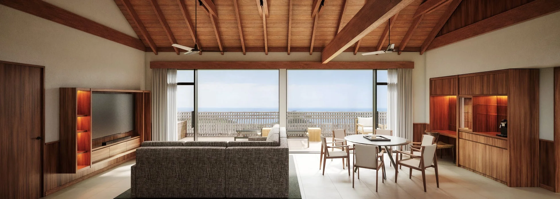 海を見渡せる広々としたリビングルームの画像