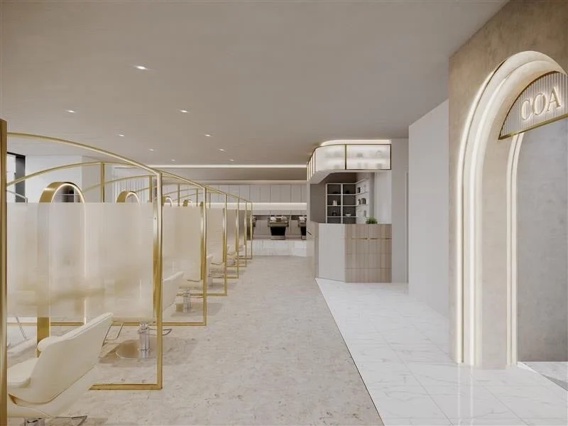 明るくモダンな美容院の内部で、ゴールドのフレームと半透明のパーテーションで仕切られたスタイリングブースが複数並んでいます。清潔感があり、洗練された空間が特徴です。